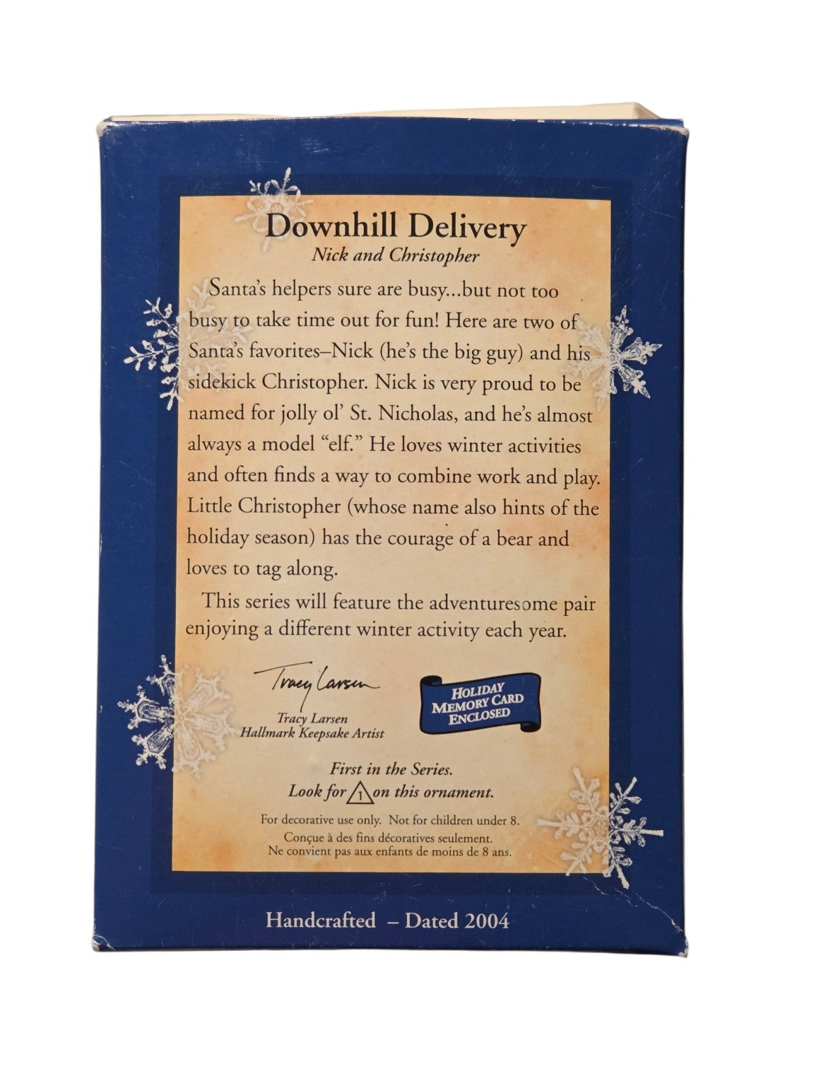 Original box back showing first-in-series details, Tracy Larsen artist credit and corner wear