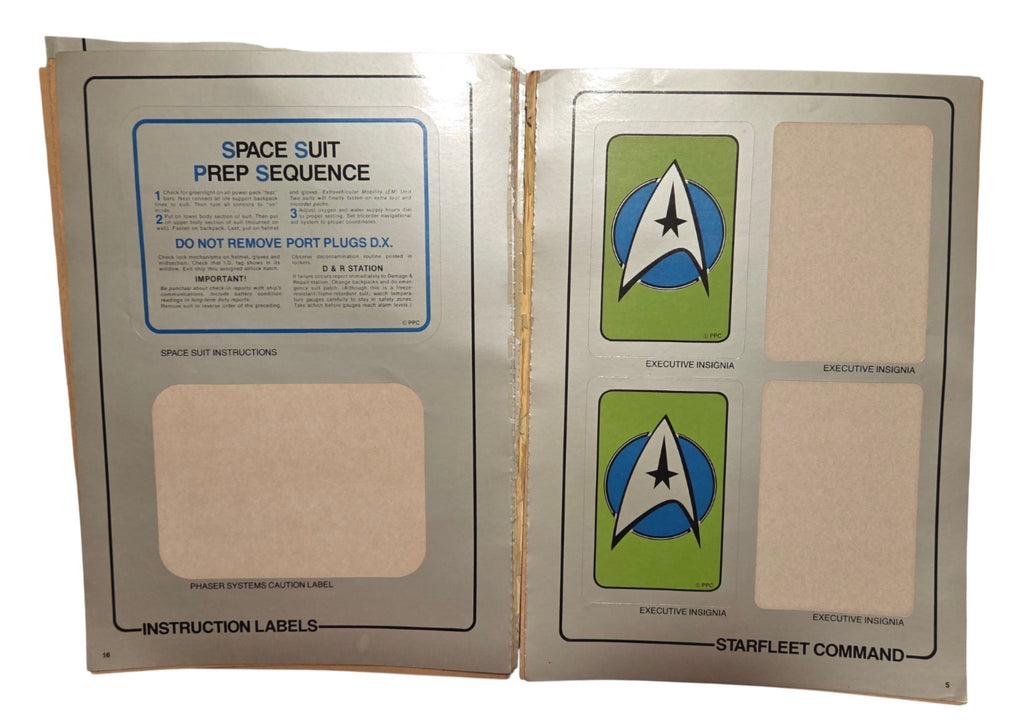 Space suit instructions and executive insignia pages with missing stickers