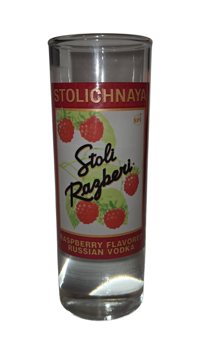 Stolichnaya Stoli Razberi raspberry vodka shot glass with red and gold label and raspberry graphic