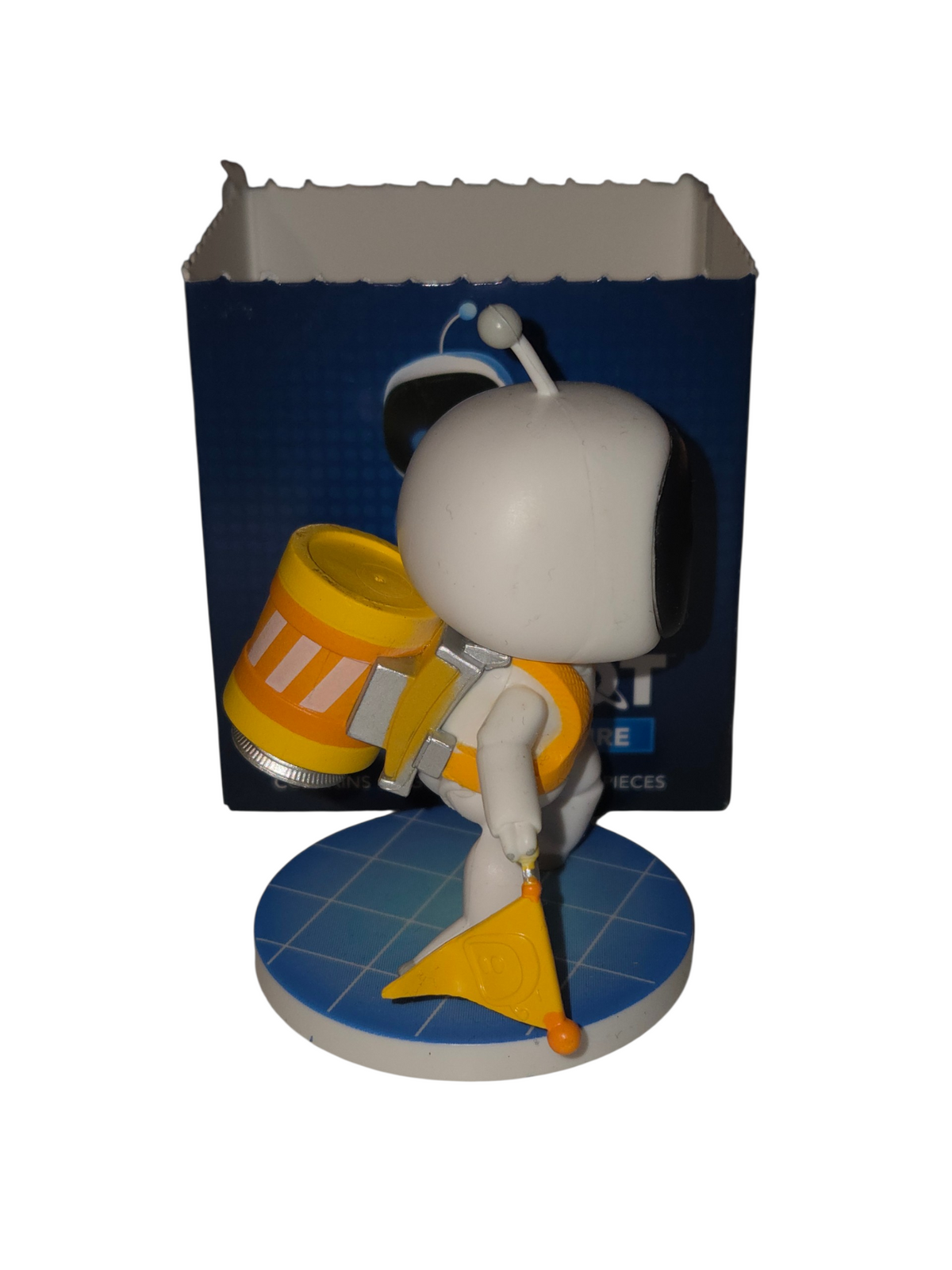 Side view of Stranded Bot showing yellow backpack, flag and blue grid display base