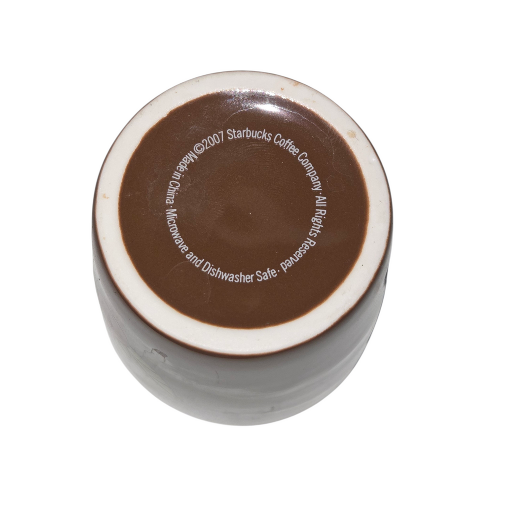 Starbucks cup base showing 2007 copyright, made in China and microwave dishwasher safe markings