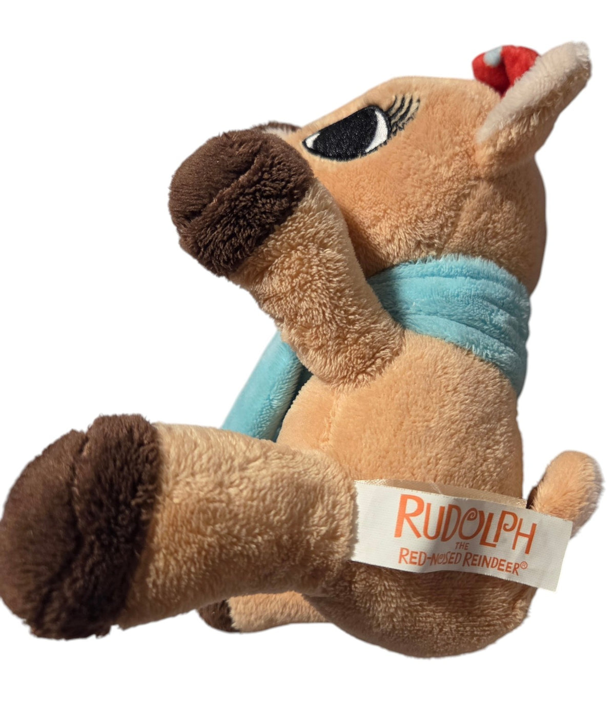 Clarice plush side view and Rudolph fabric tag