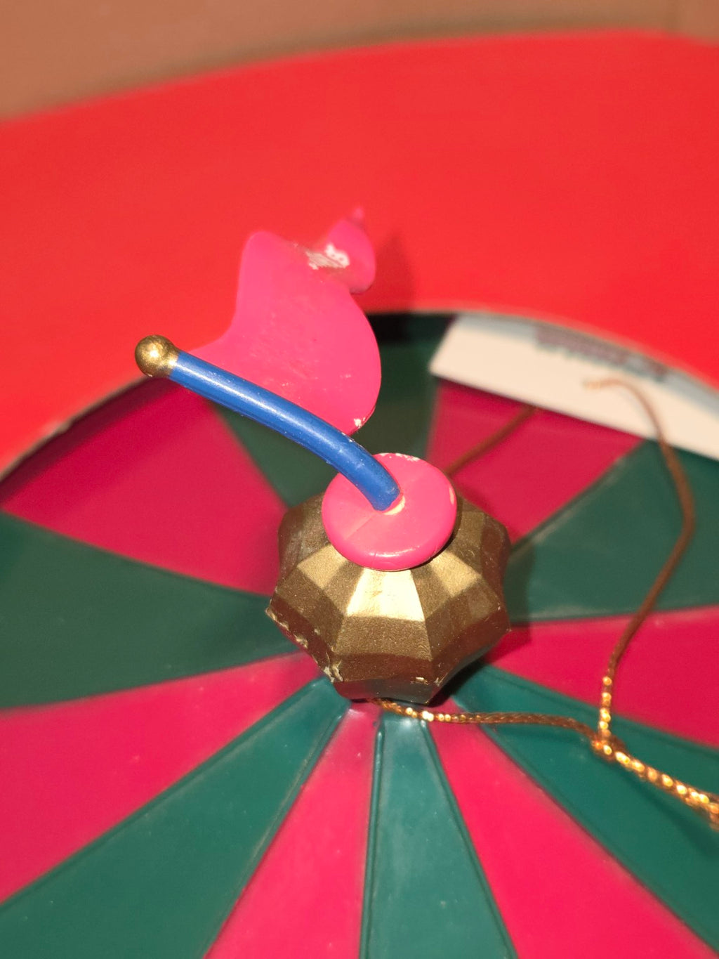 Close-up of bent carousel flagpole and paint wear