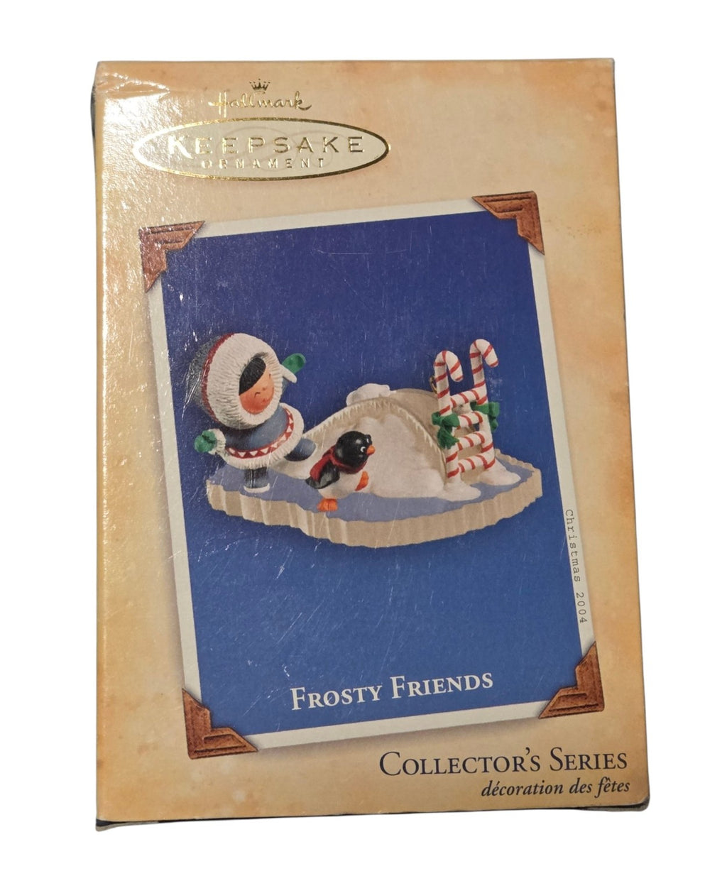 2004 Hallmark Frosty Friends 25th ornament original box front showing ice slide and penguin design