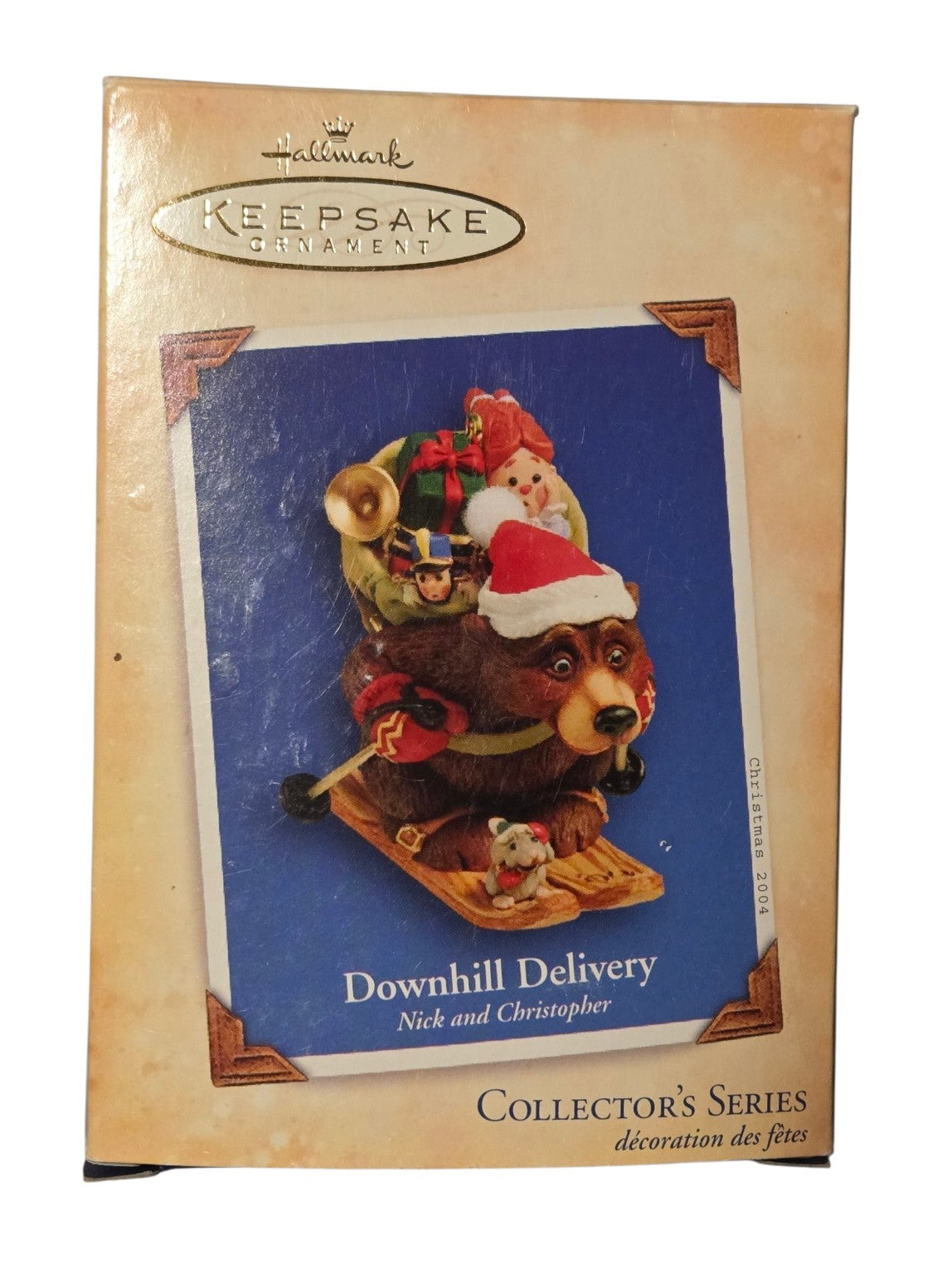 2004 Hallmark Downhill Delivery Nick and Christopher ornament box front with visible surface scuffs