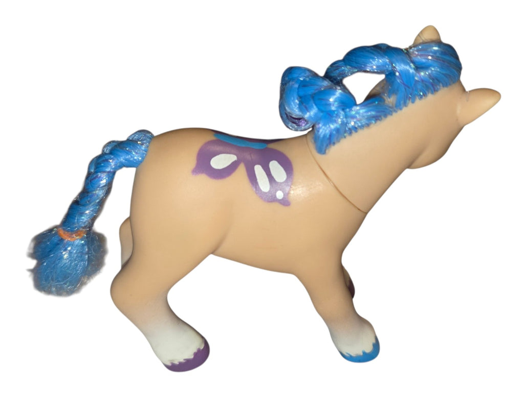 Right side of tan Lanard pony showing purple butterfly marking