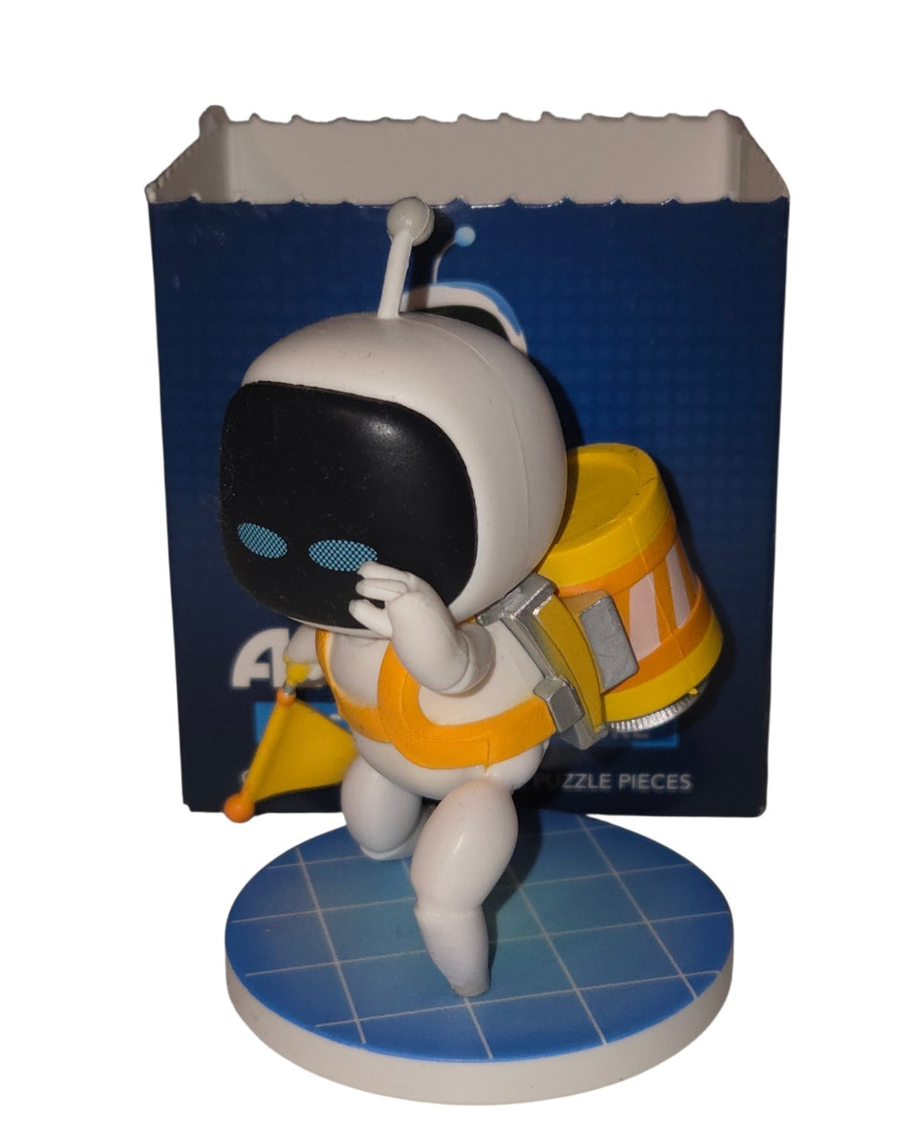CultureFly Astro Bot Stranded Bot vinyl figure front view with yellow backpack and flag