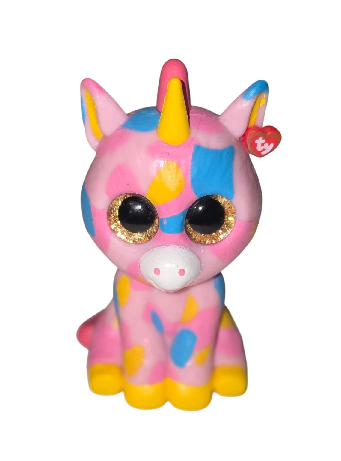 Ty Mini Boos Fantasia unicorn vinyl figure with pink, blue and yellow spots and gold glitter eyes