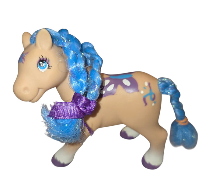 Lanard butterfly pony front and left side with braided blue tinsel mane