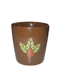 2007 Starbucks brown ceramic cup with green leaves and orange bean design