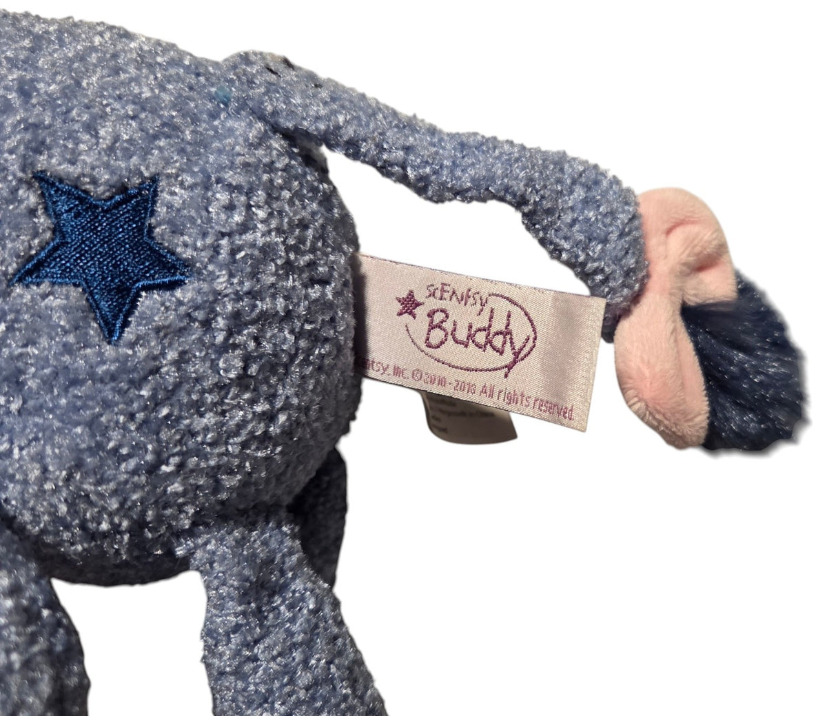 Scentsy Buddy Disney label and embroidered star on Eeyore plush