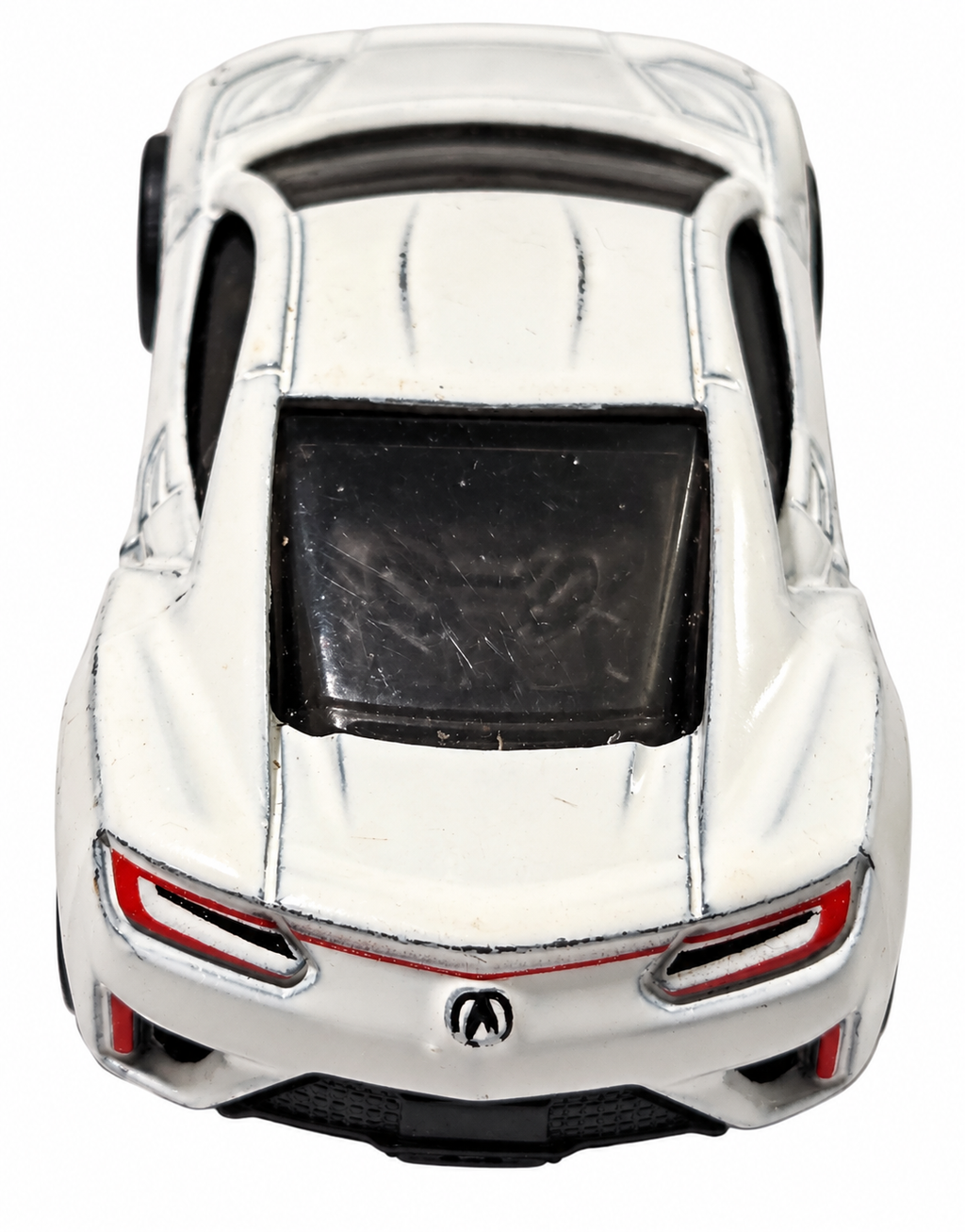 Hot Wheels white 17 Acura NSX rear view on white background