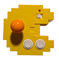 Pac-Man Connect and Play yellow pixel-shaped console with orange joystick and A/B buttons