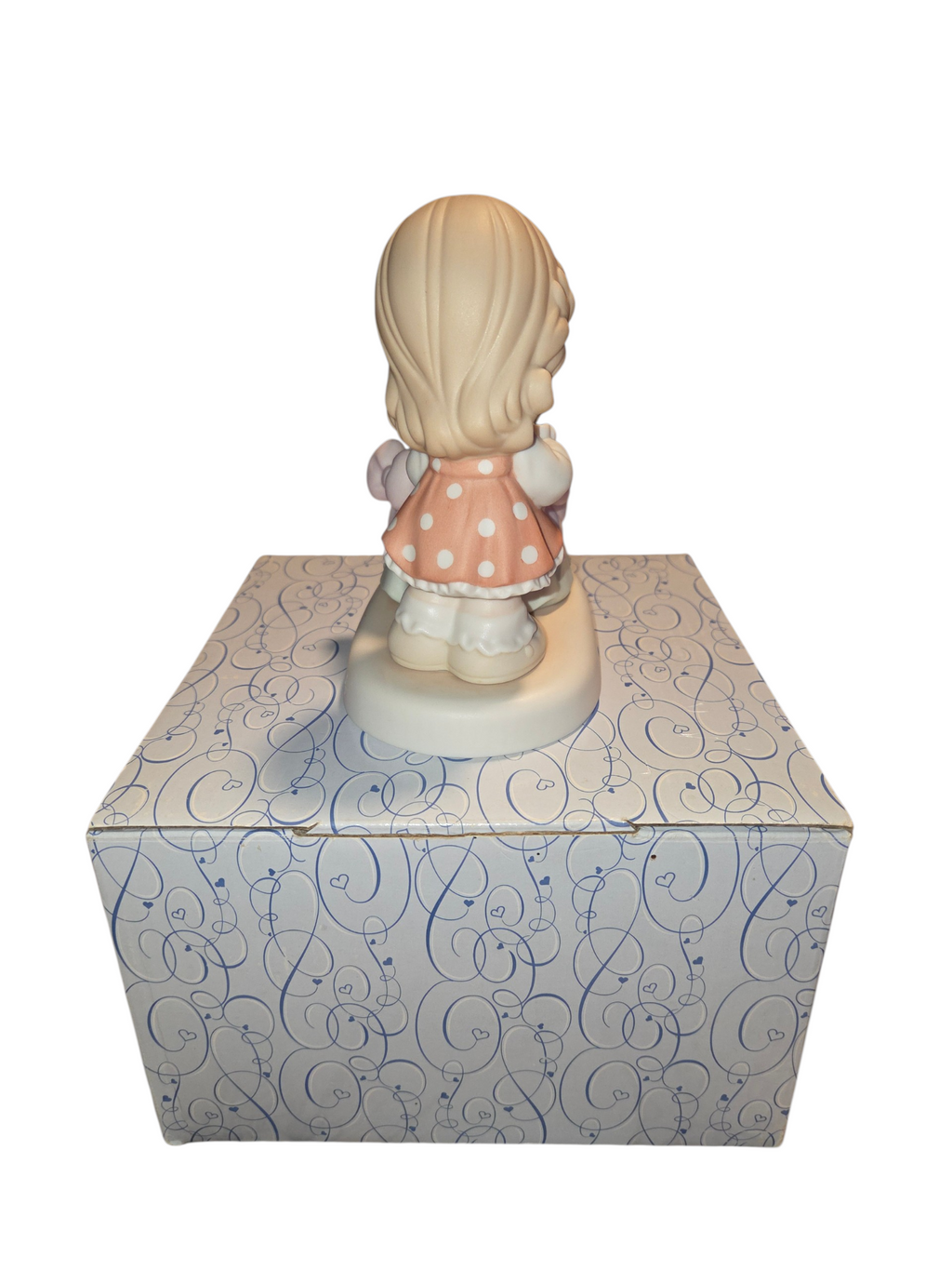 Back of Precious Moments girl in polka dot dress
