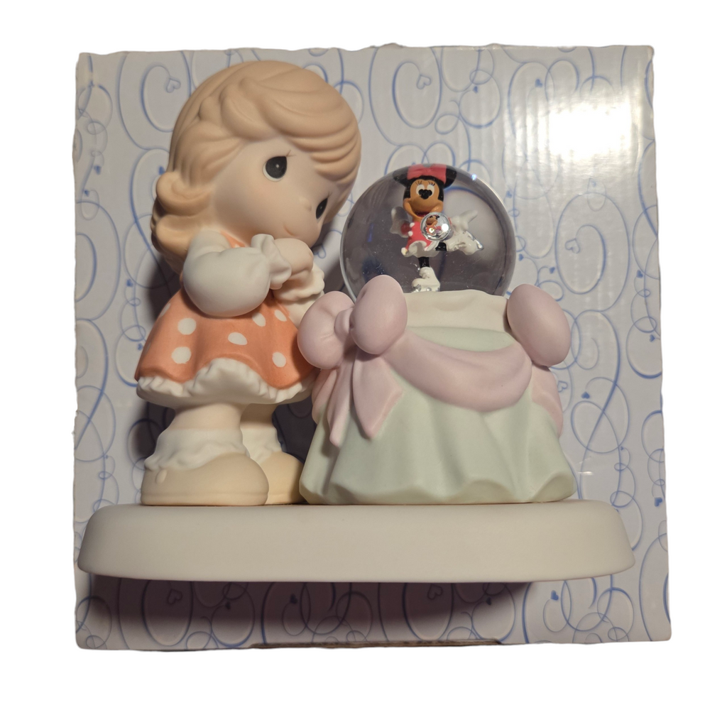 Front detail of Minnie Mouse ice skating snow globe and Precious Moments girl figurine