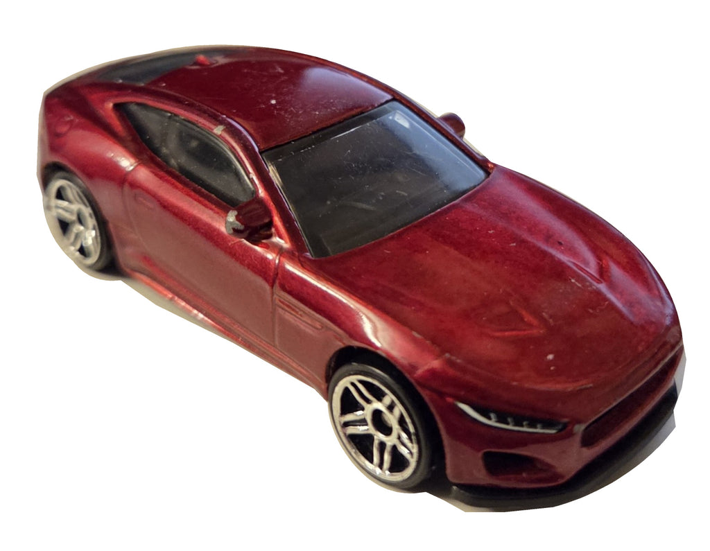 Preowned Hot Wheels red Jaguar F-Type on white background