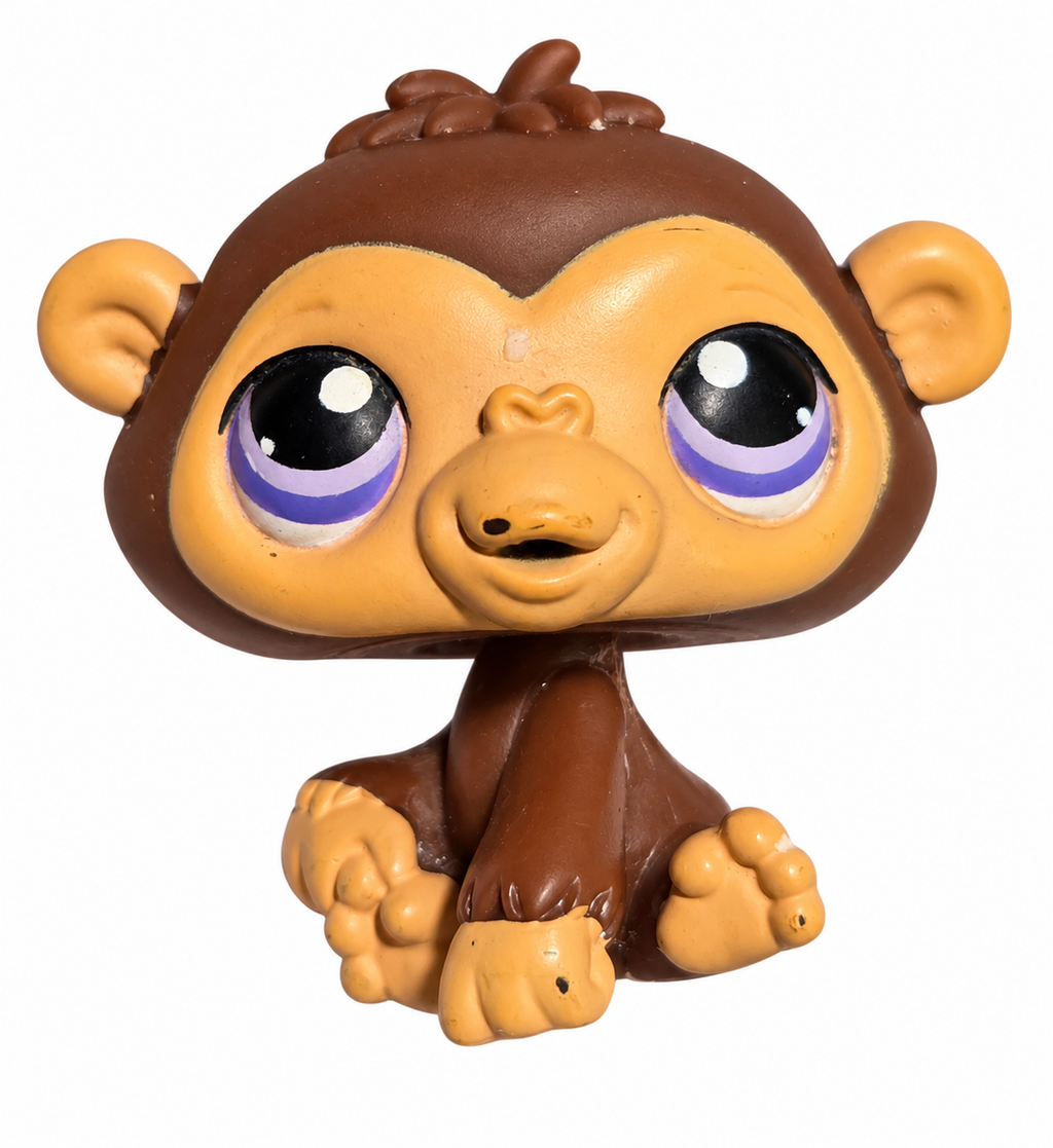 Hasbro Littlest Pet Shop chimpanzee 359 brown and tan with purple eyes on white background