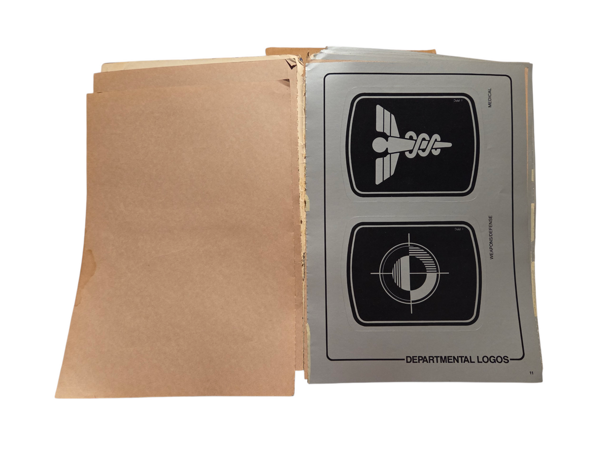 Medical and weapons logos with separated page and spine wear