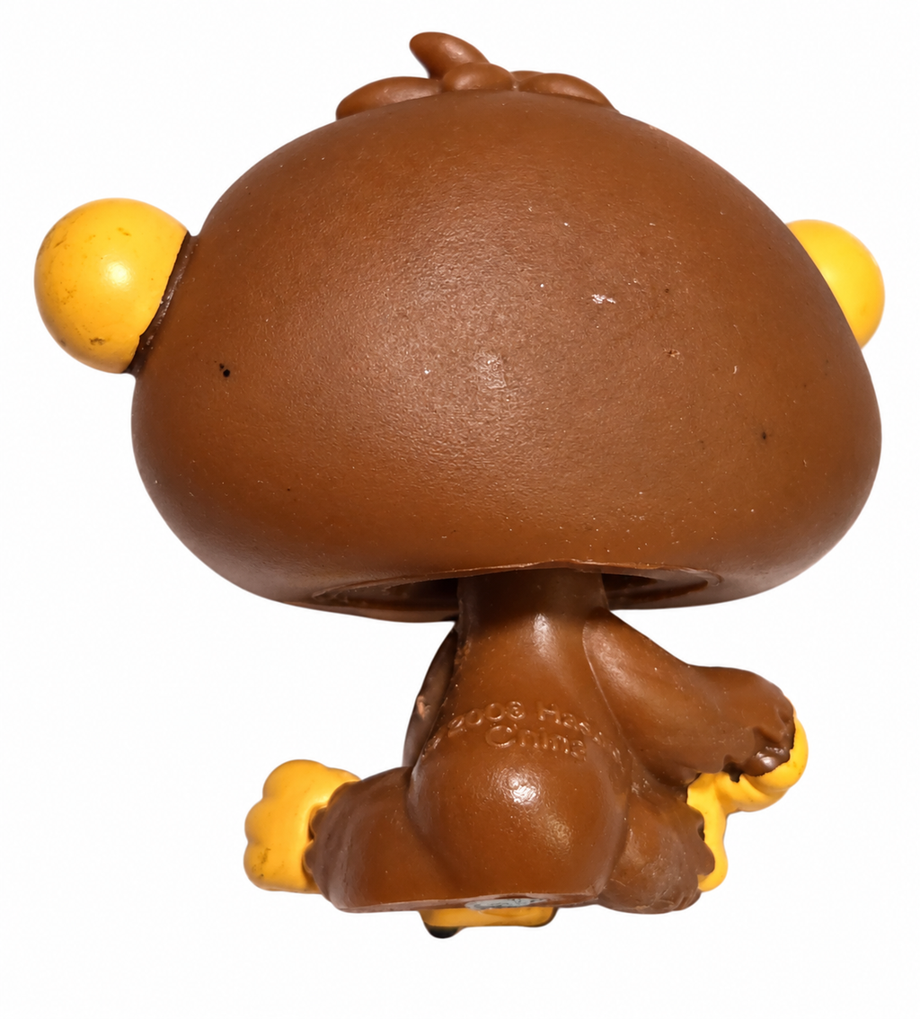 Hasbro Littlest Pet Shop chimpanzee 359 brown and tan with purple eyes on white background