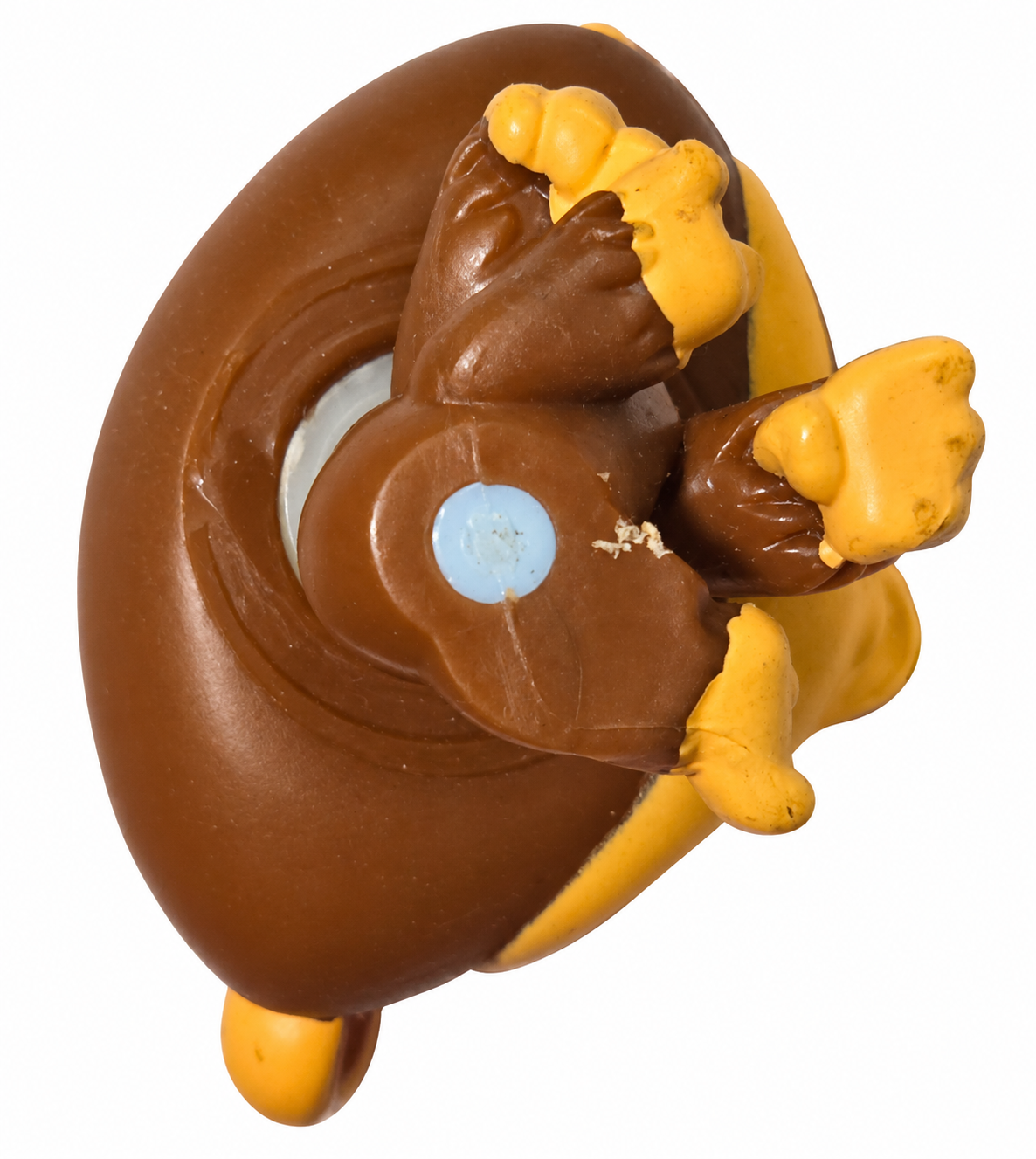 Underside of Littlest Pet Shop chimpanzee 359 showing blue magnet and playwear on white background