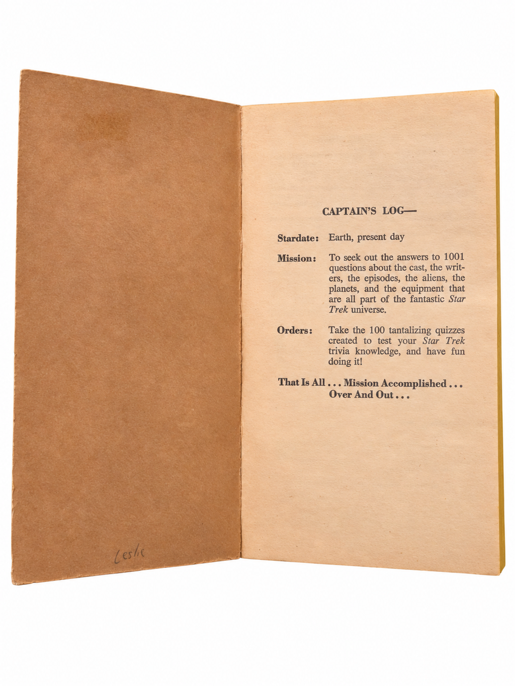 The Trekkie Quiz Book inside cover with handwritten Leslie and original tanning on white background