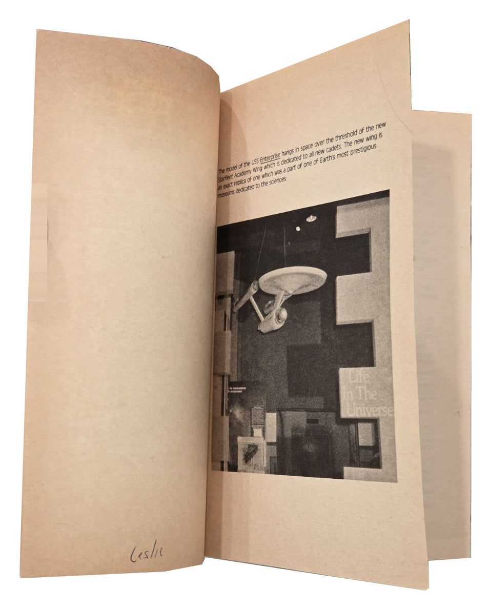Interior pages showing tanning and handwritten name Leslie