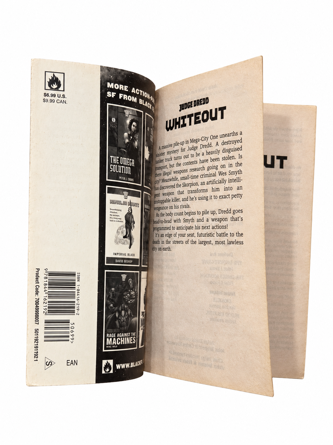 Judge Dredd Whiteout inside cover and opening pages showing original tanning and wear on white background