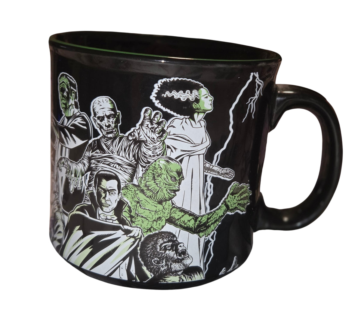 Black Universal Monsters mug with Dracula, the Mummy, Bride of Frankenstein and Creature artwork, handle on the right