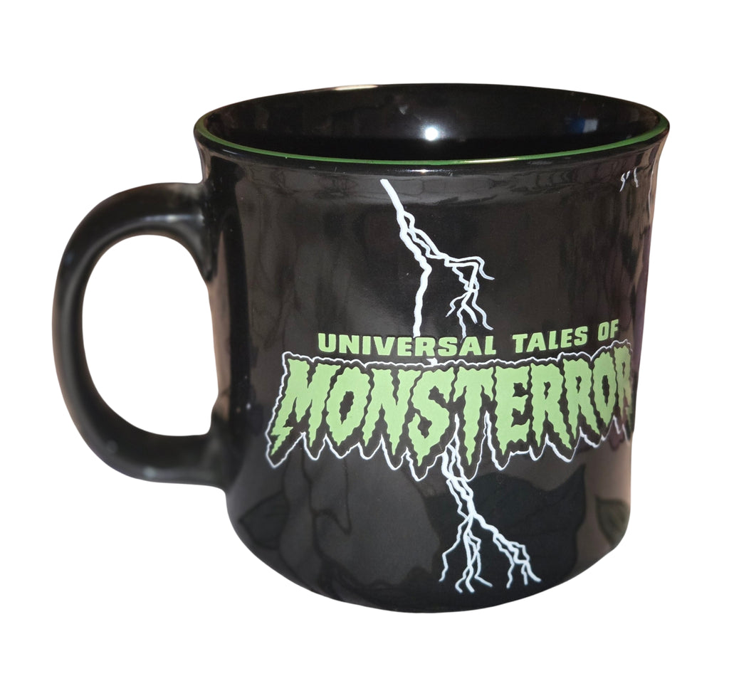 Universal Tales of Monsterror mug with green lettering and lightning, handle on the left