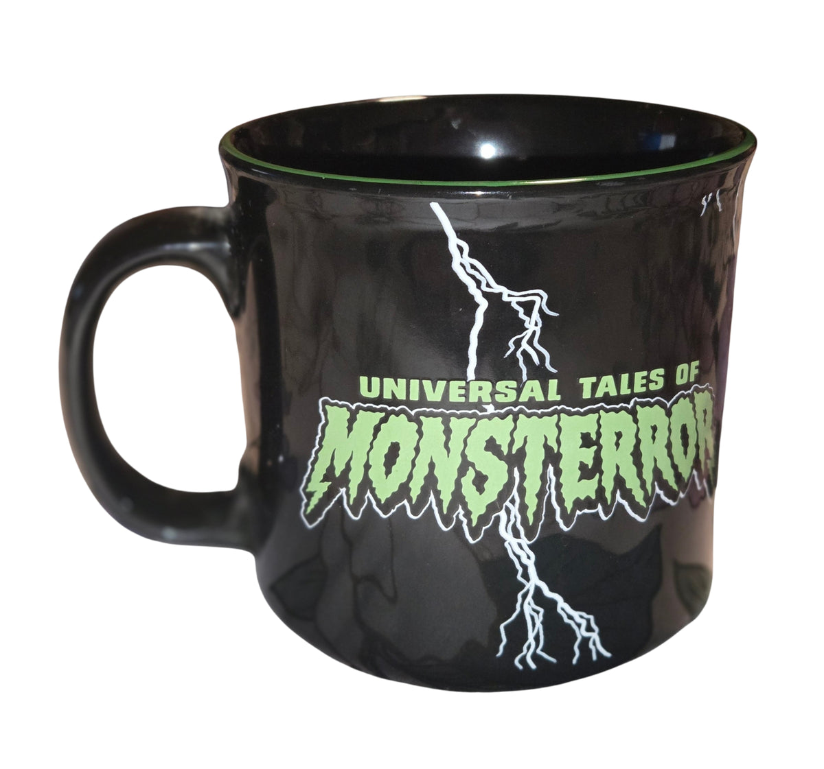 Universal Tales of Monsterror mug with green lettering and lightning, handle on the left
