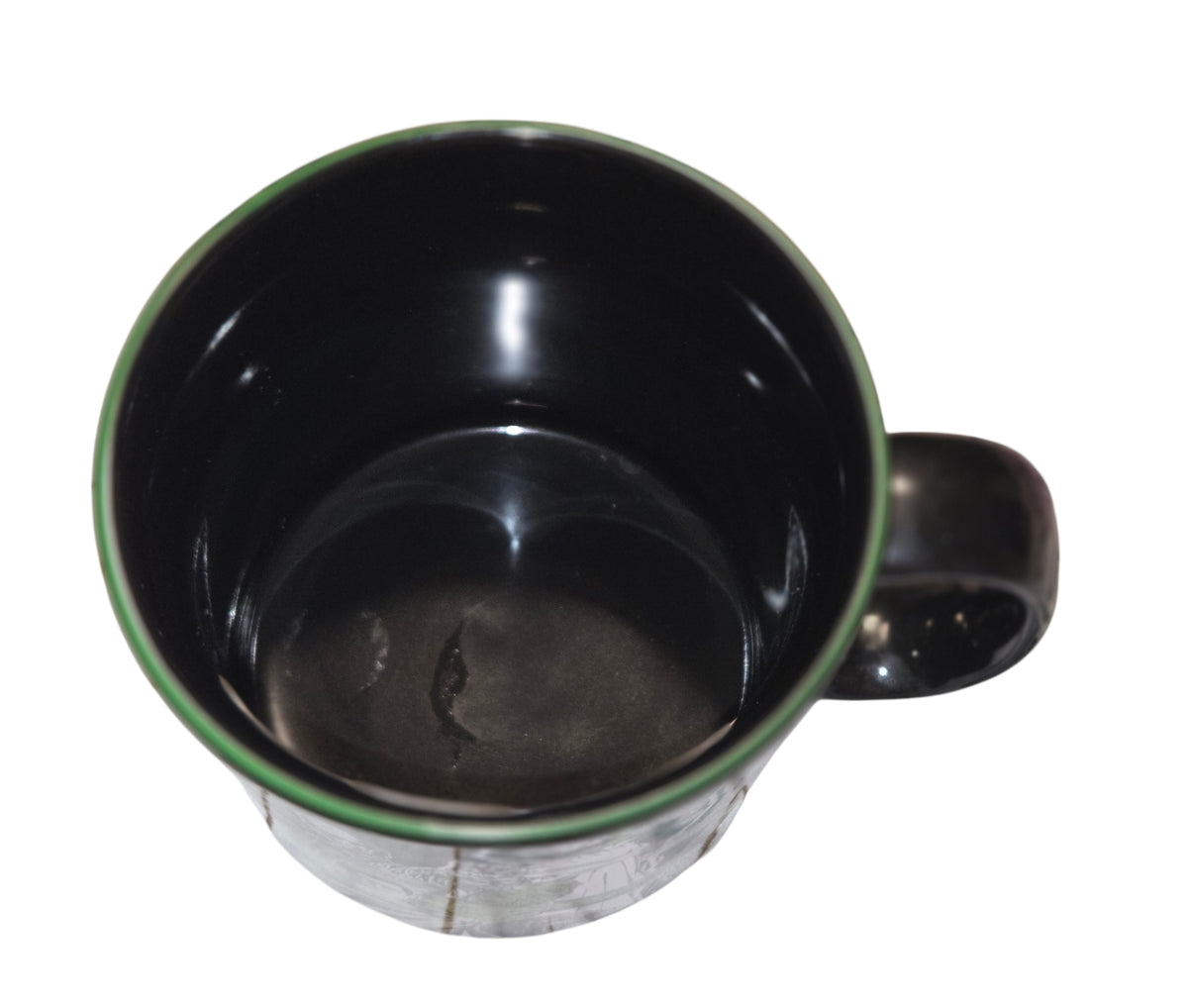 Top view of Universal Monsters mug showing the black interior and green rim