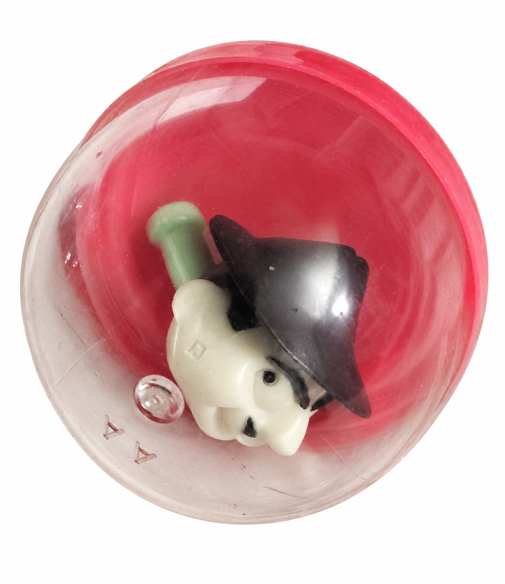 Boris Badenov vending whistle with its clear capsule and pink red base