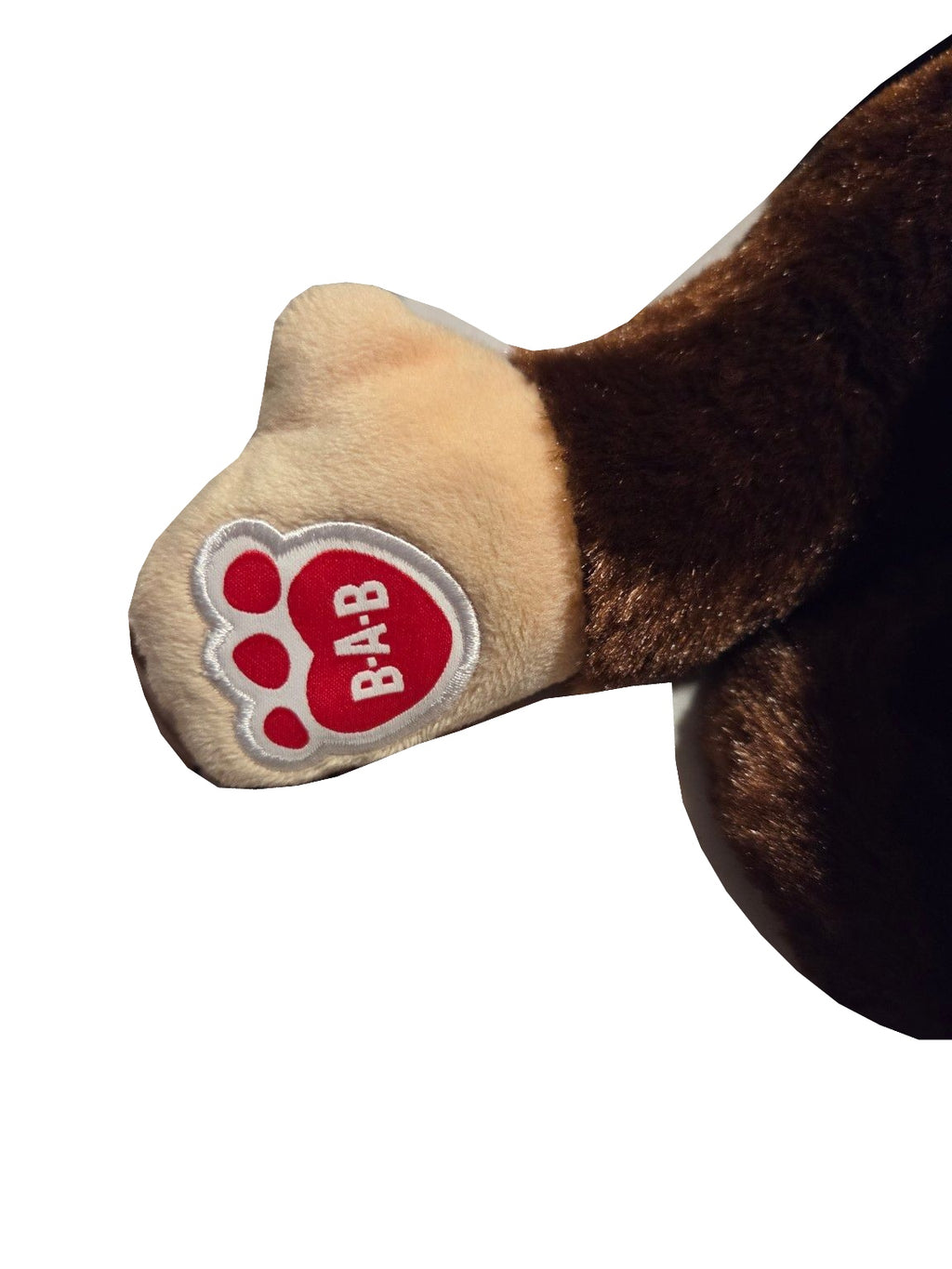 Build-A-Bear brown and tan smiling monkey plush paw view on white background