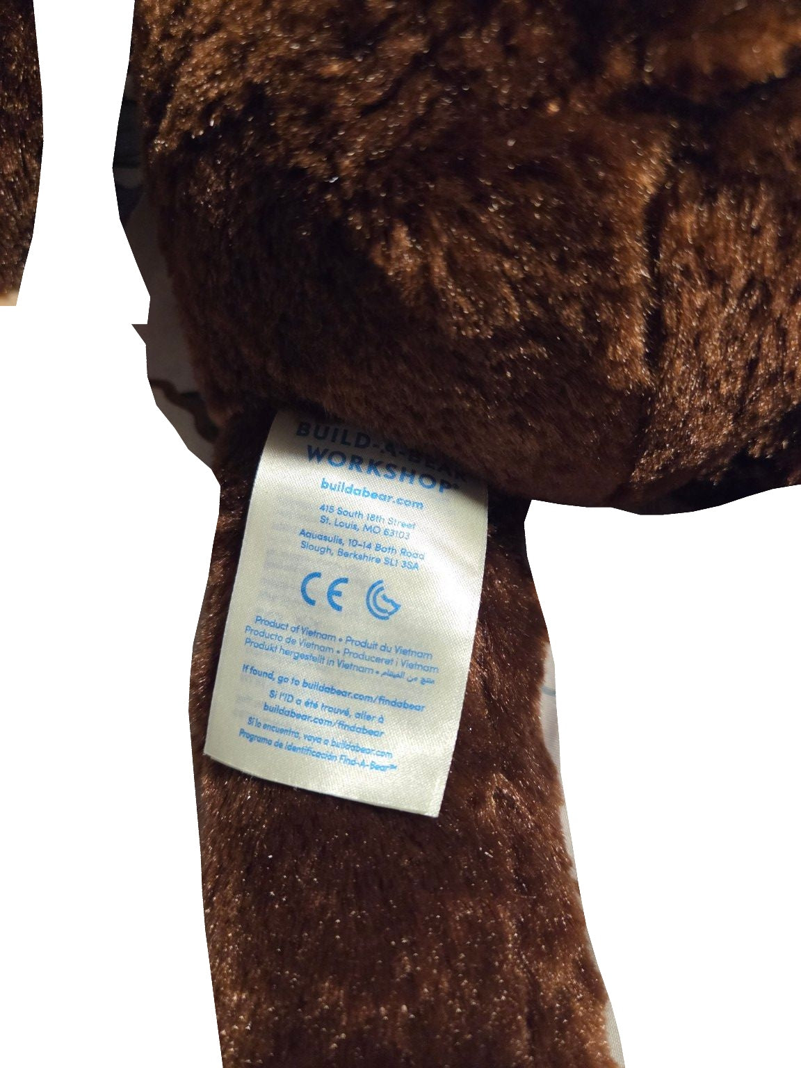 Build-A-Bear brown and tan smiling monkey plush tag view on white background