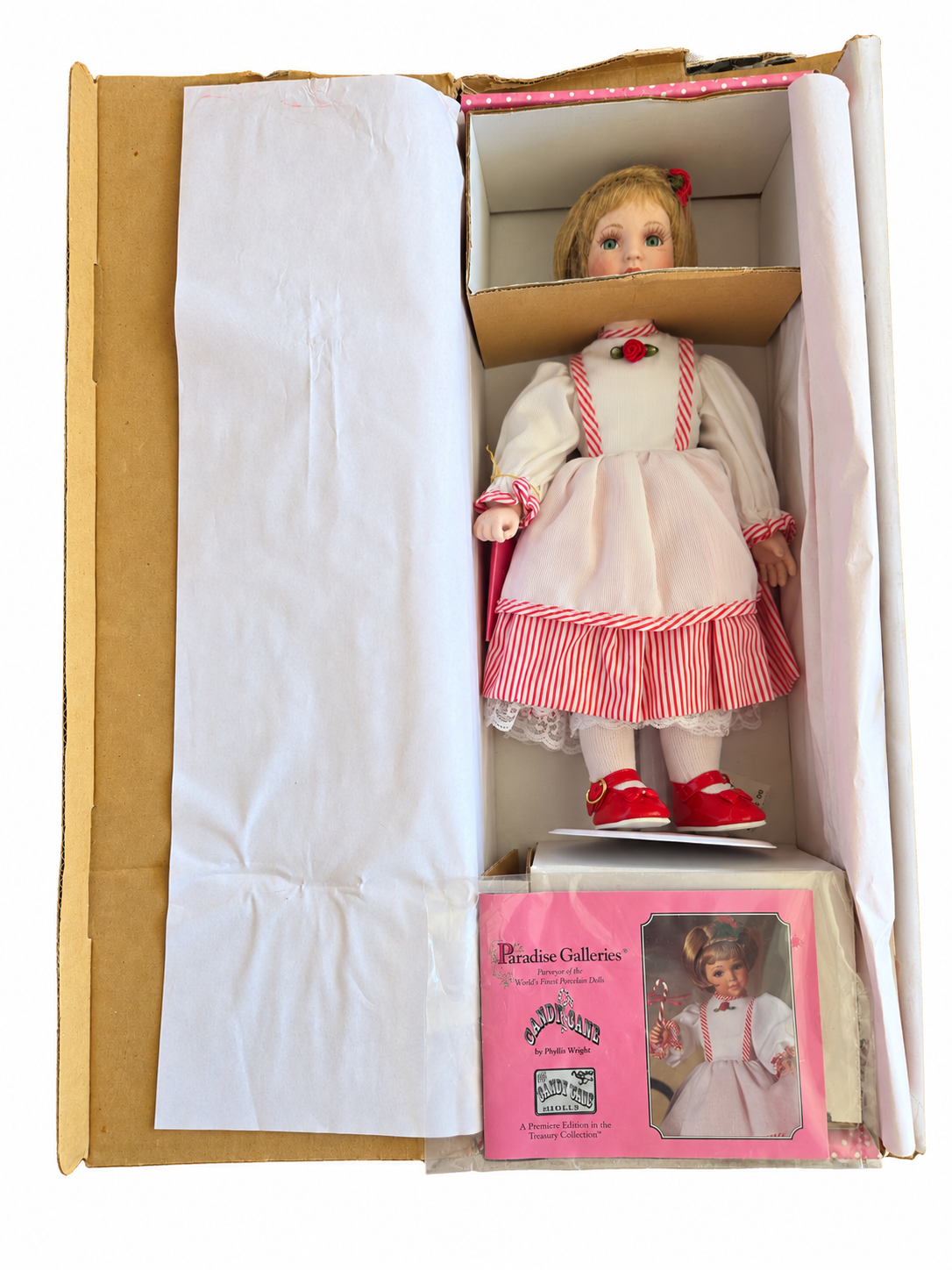 Brand new Paradise Galleries Candy Cane doll in original opened packaging with booklet