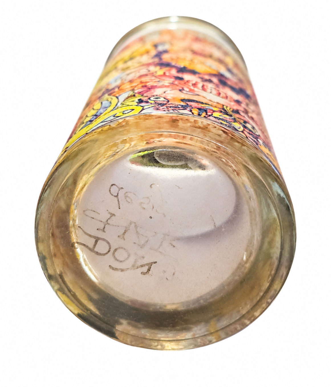 Ed Hardy tattoo collage drinking glass base view on white background