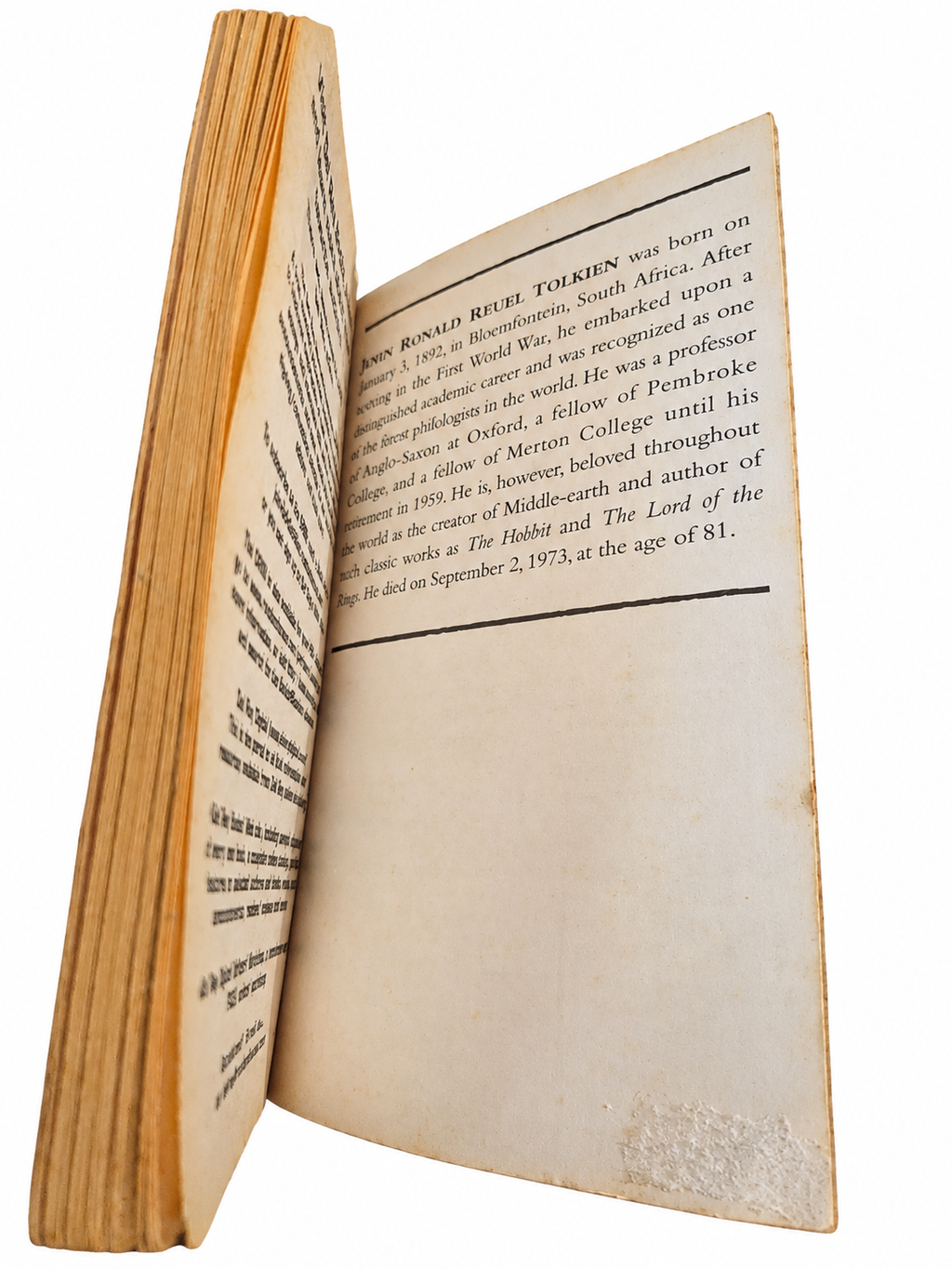Author biography page with visible lower-edge surface wear
