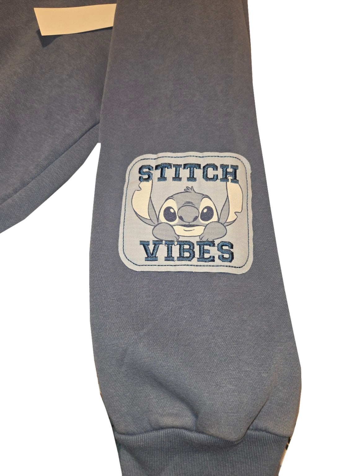 Blue Freeze Disney Stitch hoodie size Large, stitch vibes sleeve, white background