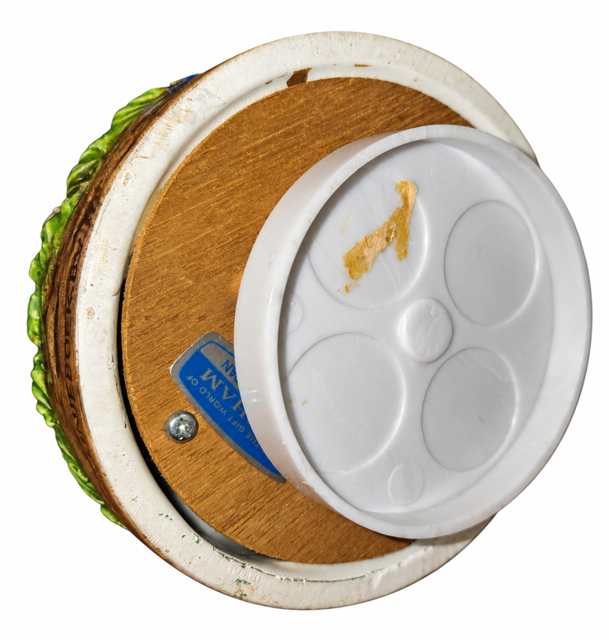 Gorham music box underside showing winding base and sticker residue