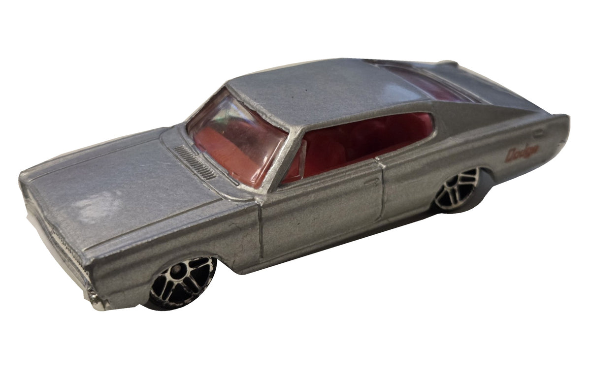 Pre-owned Hot Wheels 1967 Dodge Charger silver with red interior front-left view on white background
