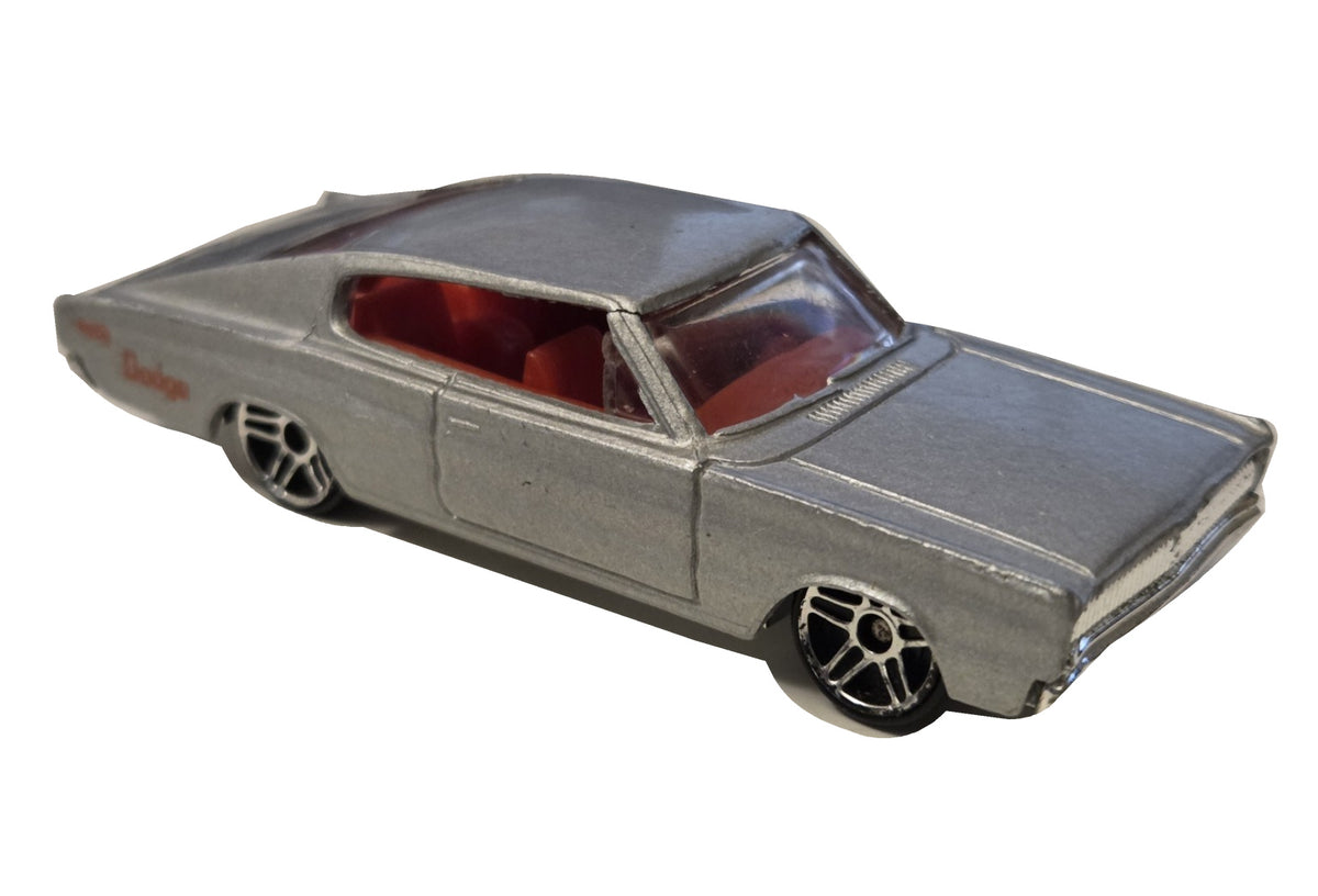 Pre-owned Hot Wheels 1967 Dodge Charger silver with red interior front-right view on white background