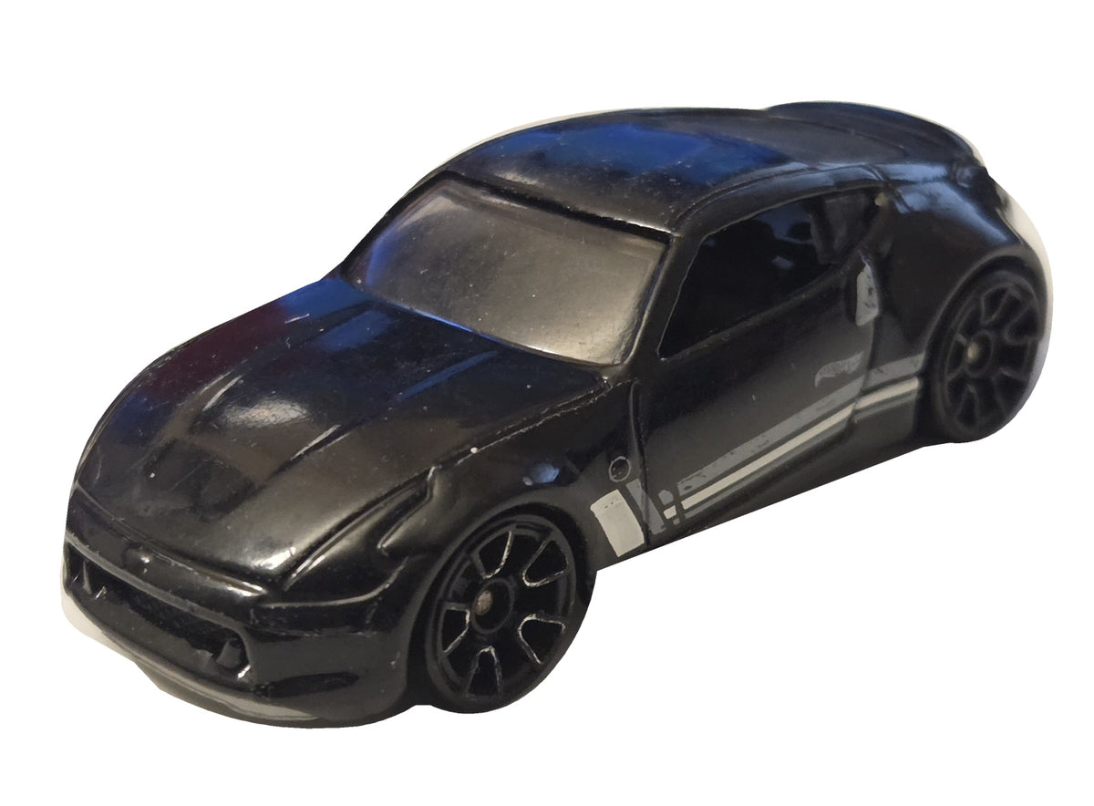 Pre-owned Hot Wheels Nissan 370Z black with white and gray stripes front-left view on white background