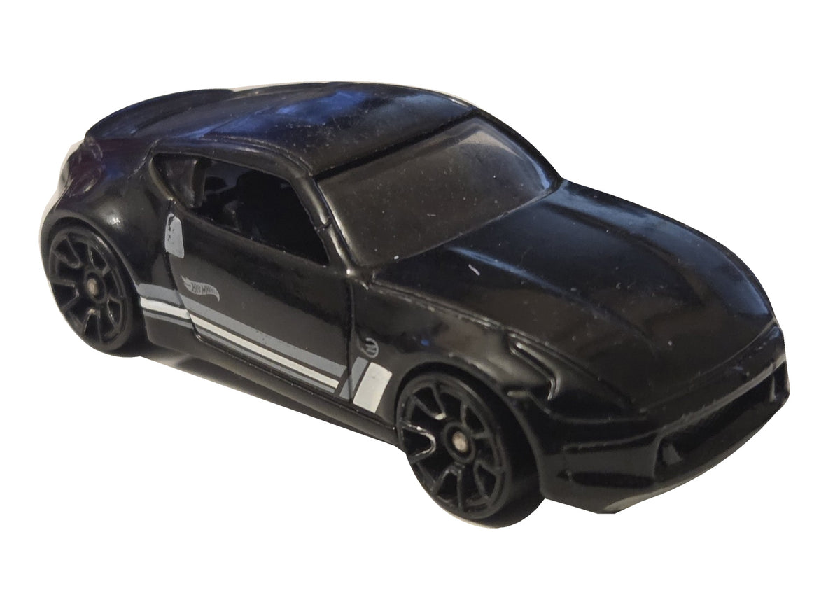 Pre-owned Hot Wheels Nissan 370Z black with white and gray stripes front-right view on white background