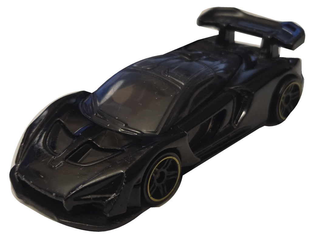 Pre-owned Hot Wheels McLaren Senna black front-right view on white background showing actual condition