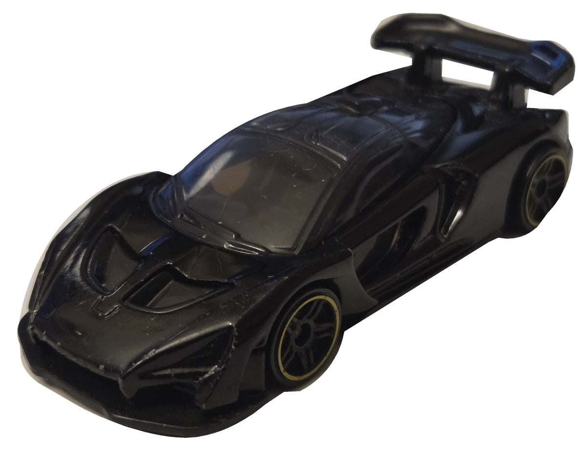 Pre-owned Hot Wheels McLaren Senna black front-right view on white background showing actual condition