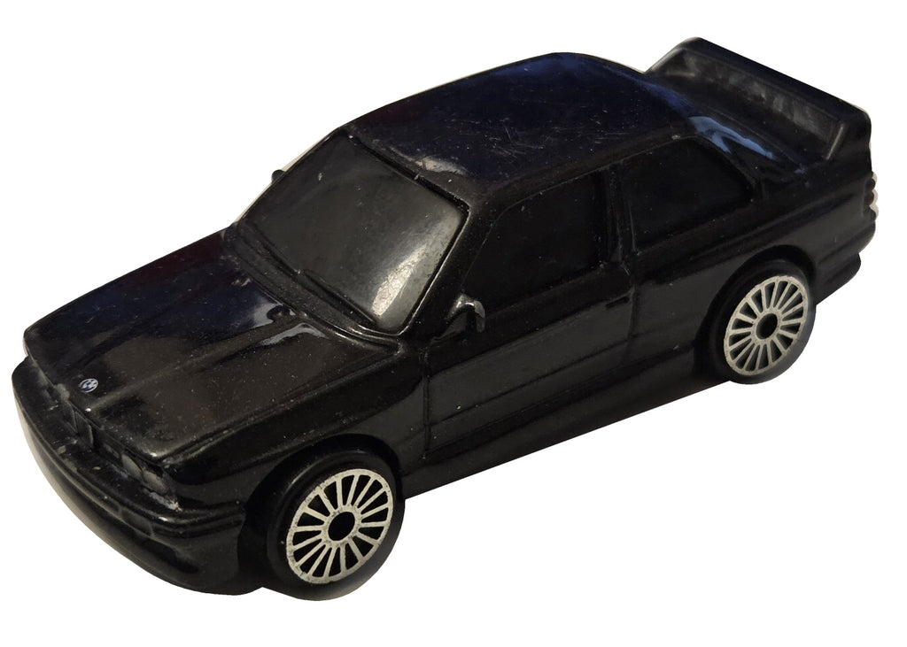 Pre-owned Maisto 1988 BMW M3 E30 black diecast car front-left view on white background showing original wear