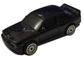 Pre-owned Maisto 1988 BMW M3 E30 black diecast car front-left view on white background showing original wear