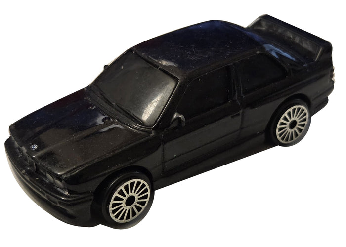 Pre-owned Maisto 1988 BMW M3 E30 black diecast car front-left view on white background showing original wear