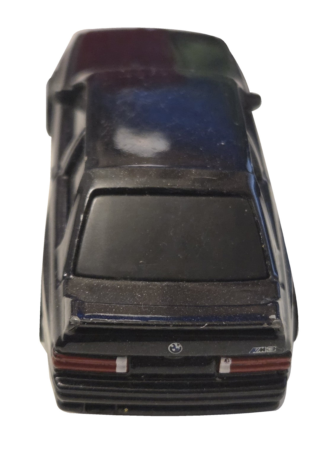 Pre-owned Maisto 1988 BMW M3 E30 black diecast car rear view on white background showing original wear