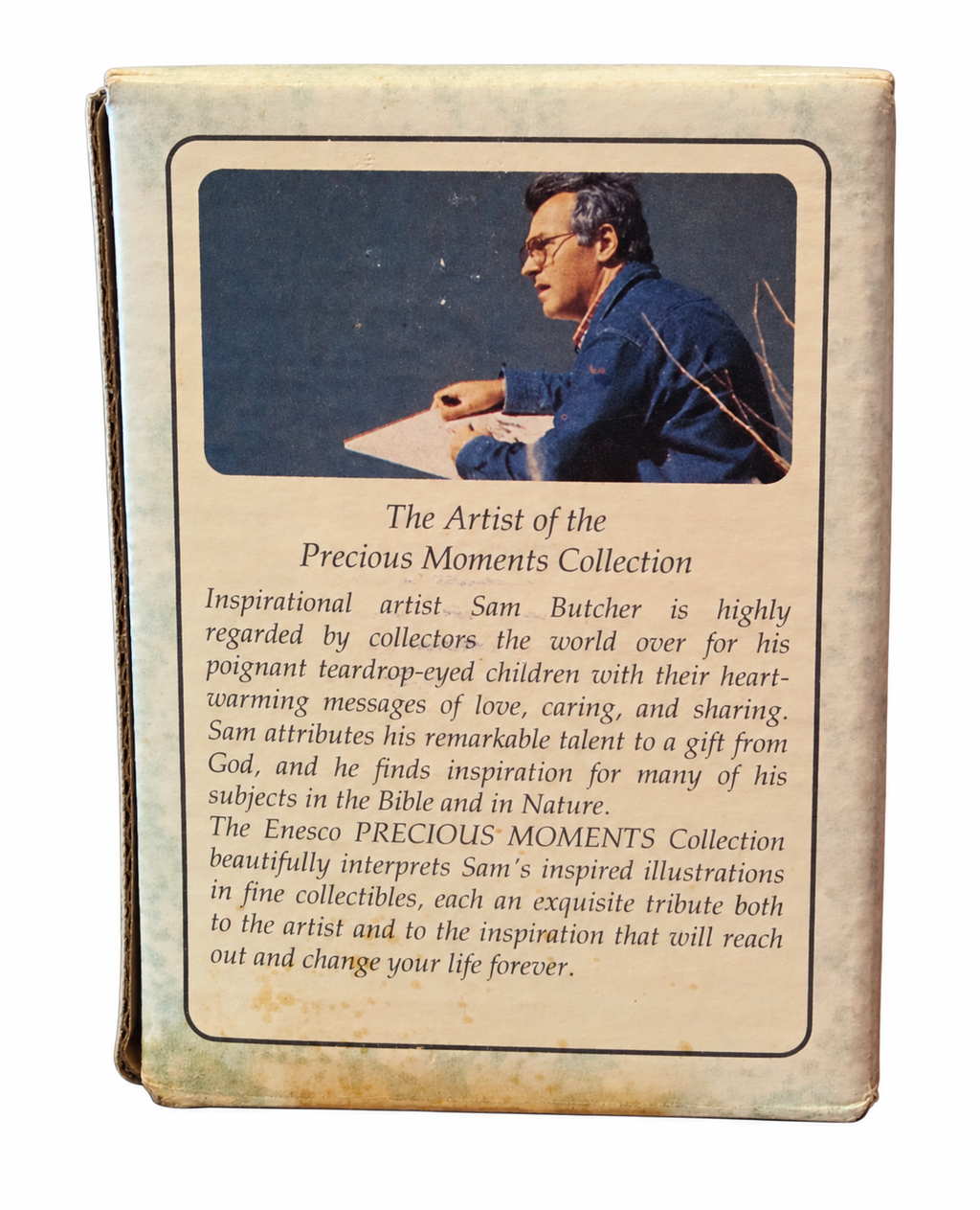 Precious Moments Baby's 1st Christmas 1995 original box back, showing packaging wear and staining